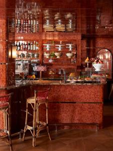 a bar in a restaurant with two chairs and a counter at Ulysses in Baltimore