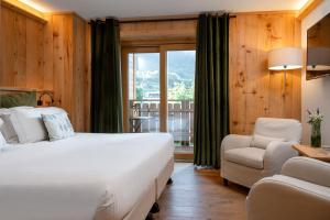 Postel nebo postele na pokoji v ubytování Hotel Baita Dei Pini