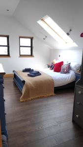 a bedroom with two beds in a room at The Cow Hide @ Mill Burn Hollow. in Millisle