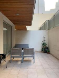 a cat sitting on a bench in a building at “Tu Lugar en Santiago” Depto SADIMA - Barrio Centro in Santiago del Estero