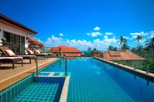 a swimming pool at a villa with a resort at Samui Sunrise Seaview Villa in Chaweng