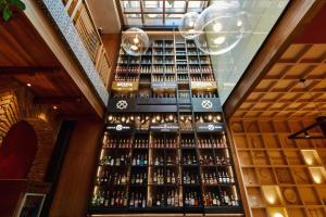 a room with a large amount of bottles of wine at Casa Firenza Hotel & Suites Boutique in Cuenca