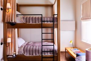 a bunk bed room with two bunk beds at The Siren Hotel in Detroit