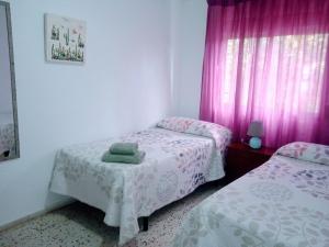 Postel nebo postele na pokoji v ubytování Casa Violeta