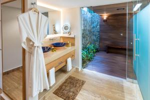 a bathroom with a shower and a sink at Presidente InterContinental Cozumel Resort & Spa, an IHG Hotel in Cozumel