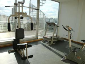 a gym with two exercise bikes and a window at Espectacular Departamento en San Telmo - Piscina, Lavadero y Parrilla in Buenos Aires