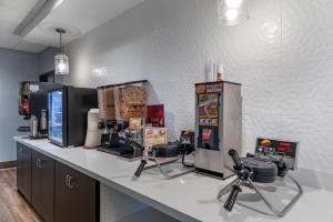 a kitchen with a counter with a popcorn machine at Best Western Plus Desert View Inn & Suites in Cathedral City