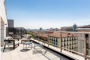 a balcony with a view of a city at Radisson RED Madrid in Madrid