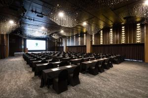 a large room with tables and chairs in it at Banyan Tree Club & Spa Seoul in Seoul