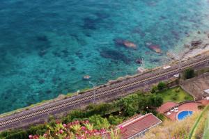 an aerial view of the beach and the ocean at Il Signò Cocco mare apartment in Taormina