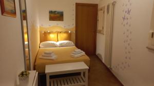 Postel nebo postele na pokoji v ubytování Villino Tronchetto Bianco