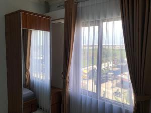 Fotografie z fotogalerie ubytování Bening Asri Guesthouse v destinaci Gombolpaya