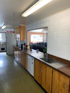 a kitchen with a counter and a couch in a room at Wedderburn Farm Stay in Wedderburn