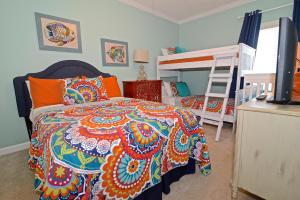 a bedroom with a bed and a bunk bed at Dolphin Harbor 3C in Orange Beach +31 photos