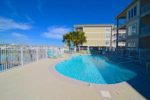 a swimming pool with a slide in a resort at Dolphin Harbor 3C in Orange Beach