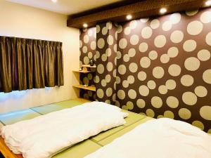 Postel nebo postele na pokoji v ubytování AYA Hotel
