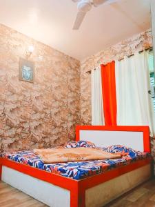 Кровать или кровати в номере Atithi Guest House