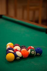 a group of billiard balls on a pool table at Huon Gulf Hotel in Lae