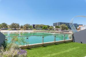 a view of a body of water with a roller coaster at Maraboo Island Beachfront Villa in Fremantle