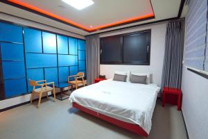 Postel nebo postele na pokoji v ubytování Hotel Danube Seomyeon