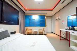 Postel nebo postele na pokoji v ubytování Hotel Danube Seomyeon
