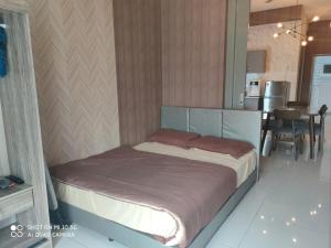 En eller flere senge i et værelse på Bangi Gateway Service Apartment