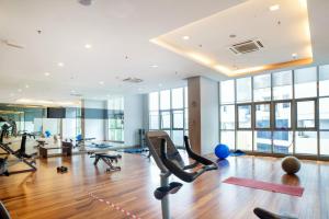 a gym with exercise equipment in a building at La Vista @ Regalia Residence in Kuala Lumpur