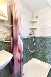 a bathroom with a shower and a sink at Apartments Jera- barbecue in Sevid