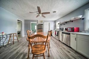 a kitchen with a table and chairs and a ceiling fan at Spacious Geneva House Less Than 5 Mi to The Strip! in Geneva