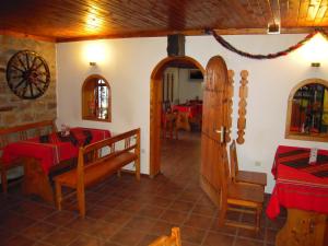 a room with a dining room with a table and chairs at Panorama Hotel in Arbanasi