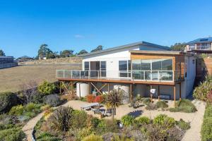 a house on a hill with a garden at Windbourne House The Ultimate Base in St Helens