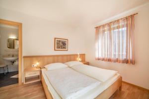 Ένα ή περισσότερα κρεβάτια σε δωμάτιο στο Parigger Apt Zirbe