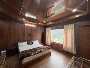 Postel nebo postele na pokoji v ubytování Ramneek Homestay