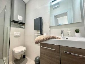 a bathroom with a sink and a toilet and a mirror at LA MASCOTTE in Saint-Louis +68 photos
