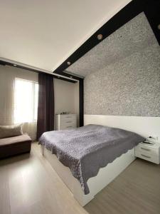 מיטה או מיטות בחדר ב-Роскошная Вилла Zuri