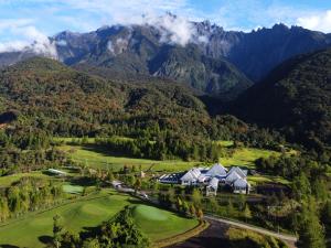 an aerial view of a golf course in the mountains at Sweeping Mountain View Retreat at La Cantane Villa in Kundasang