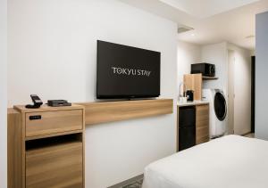 TV a/nebo společenská místnost v ubytování Tokyu Stay Shibuya Shin-Minamiguchi
