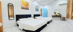 Postel nebo postele na pokoji v ubytování Kota Kinabalu Sabah City Homestay