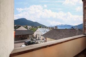 a view from a balcony of a town with mountains at Ferienwohnung Burgeis in Burgusio