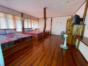 a room with two beds and a fan at Koh Mak Green View Resort in Ko Mak