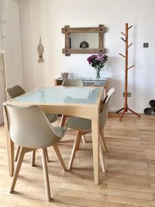 a dining room with a table and chairs at The Beach House Broadstairs in Broadstairs