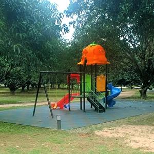 a playground with an orange top and a slide at Mangolia Farm in San Juan