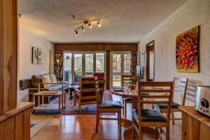 a dining room with a table and chairs at Appartement Savoleyres 30 in La Tzoumaz