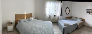 A bed or beds in a room at Senza Pensieri via Viviani