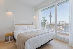 Łóżko lub łóżka w pokoju w obiekcie Uma Suites O'Donnell