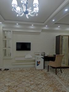 TV a/nebo společenská místnost v ubytování Hotel Firuza