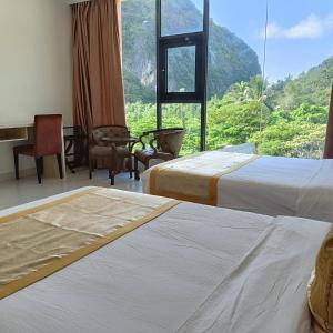 Postel nebo postele na pokoji v ubytování One El Nido Suite + 37 fotografií