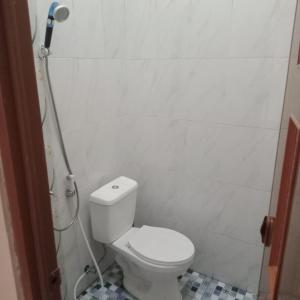 a bathroom with a toilet and a shower at Lavanta Guest House 