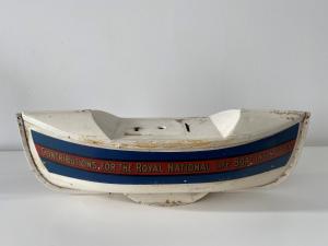 an old boat sitting on top of a table at 1 The Bay - Stunning contemporary flat on the Scottish coast in Coldingham