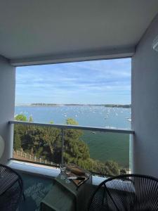 a large window in a room with a view of the water at Rosa*Studio *Belle Vue Mer*Dinard* in Dinard